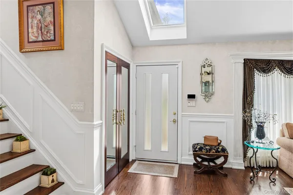 a hallway with a dining table and chairs