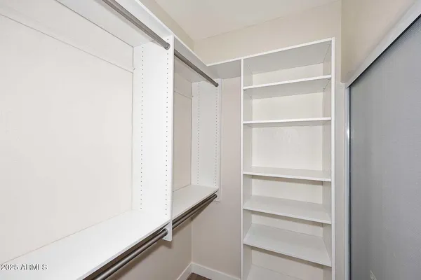 a view of an empty walk in closet