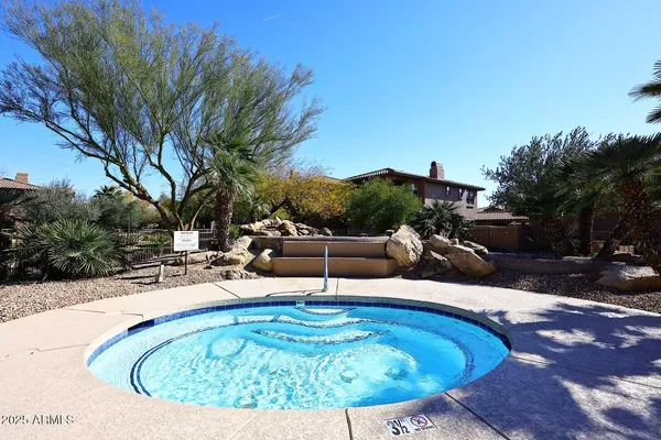 a view of swimming pool with seating space