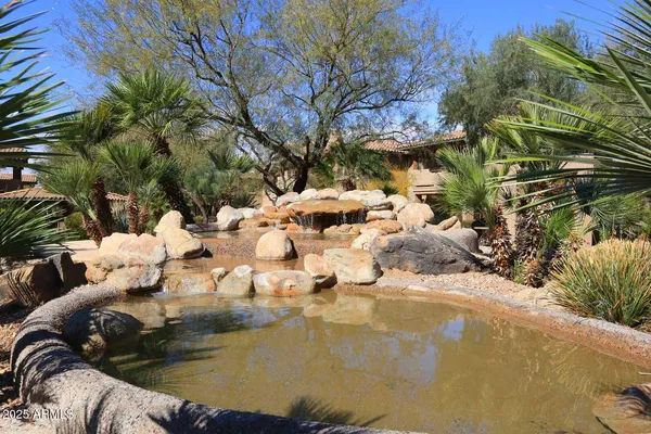a view of swimming pool with a yard