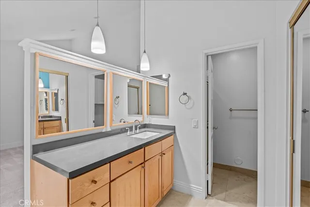 a bathroom with a sink a vanity and a mirror