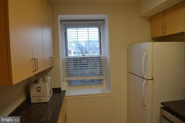 a view of walk in closet with window