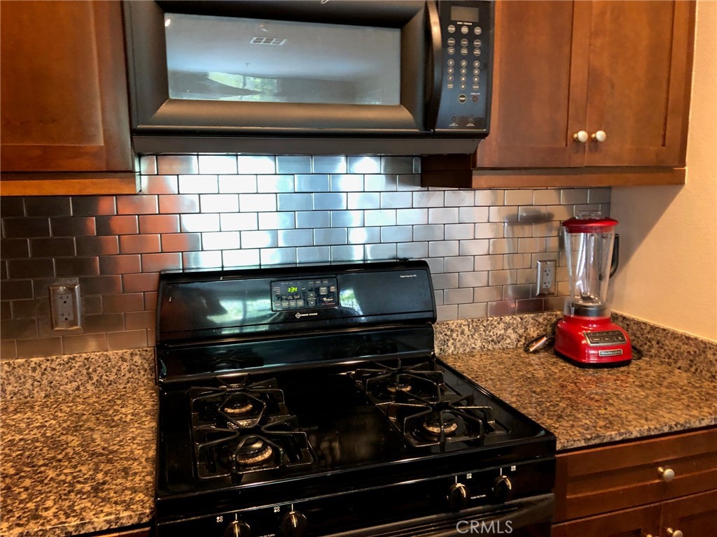 2377 Scholarship Irvine, CA 92612 - Photo 14 of 37 a stove top oven sitting inside of a kitchen