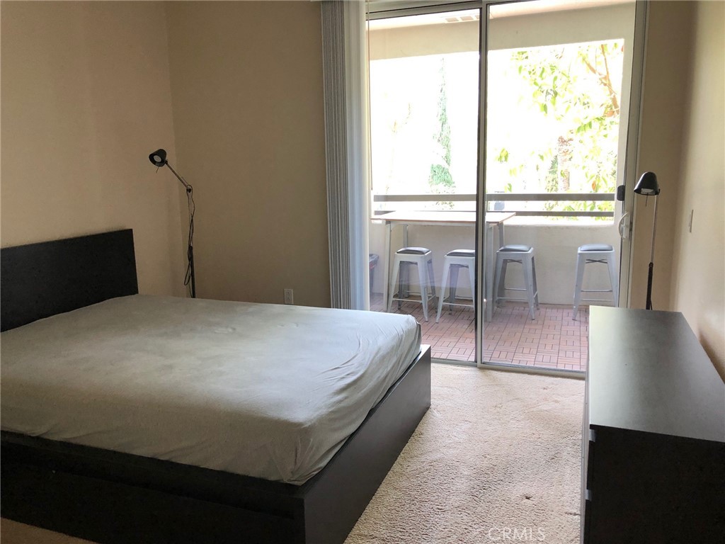 2377 Scholarship Irvine, CA 92612 - Photo 25 of 37 a bed sitting in a bedroom next to a window