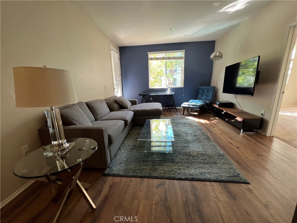 2377 Scholarship Irvine, CA 92612 - Photo 4 of 37 a living room with furniture and a flat screen tv