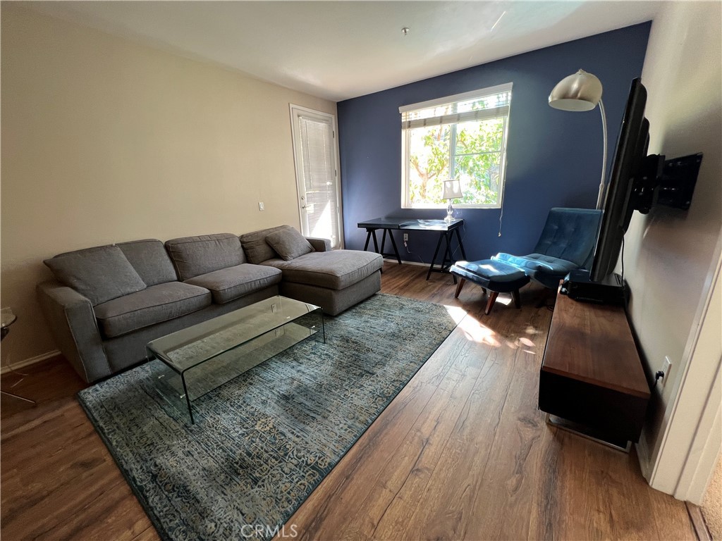 2377 Scholarship Irvine, CA 92612 - Photo 5 of 37 a living room with furniture and wooden floor