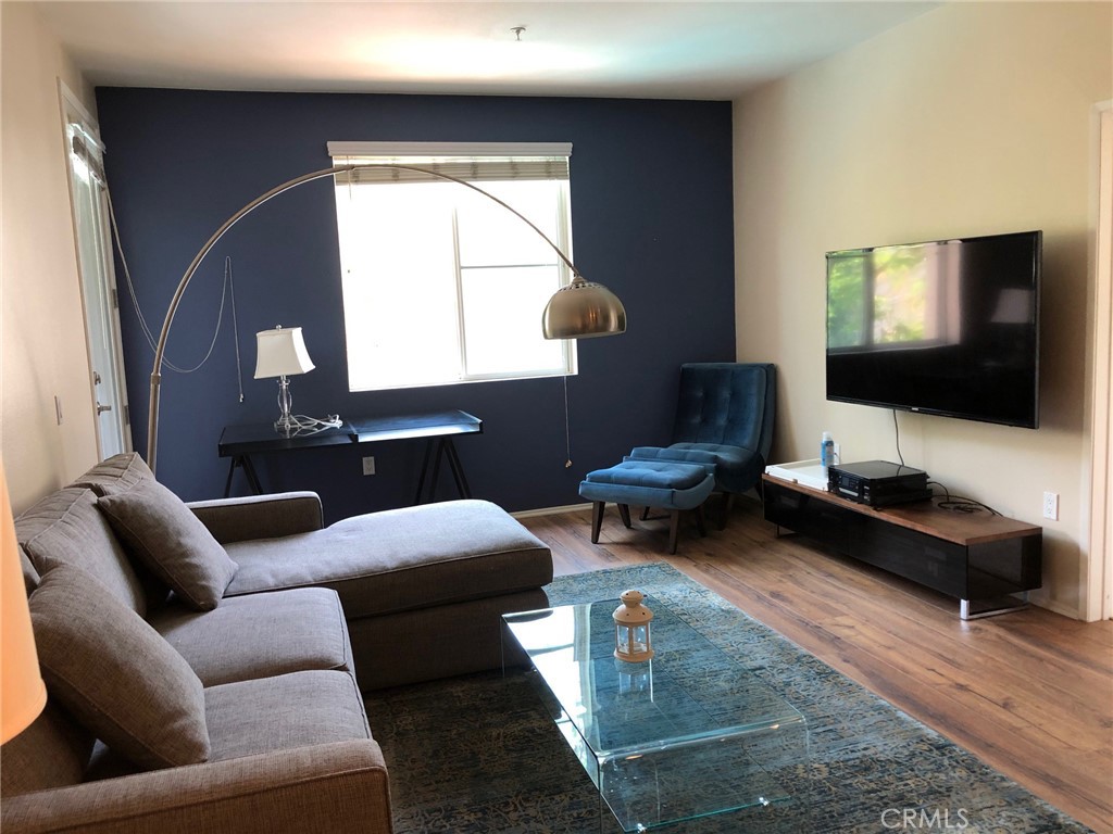 2377 Scholarship Irvine, CA 92612 - Photo 6 of 37 a living room with furniture and a flat screen tv