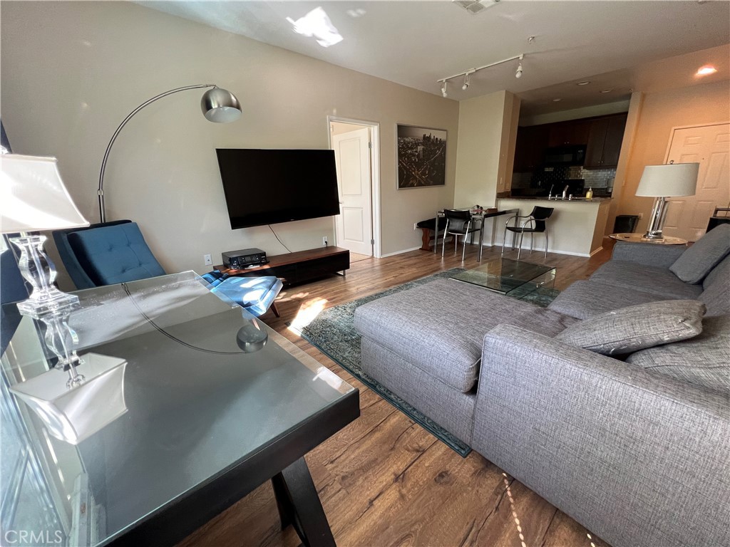 2377 Scholarship Irvine, CA 92612 - Photo 8 of 37 a living room with furniture and a flat screen tv