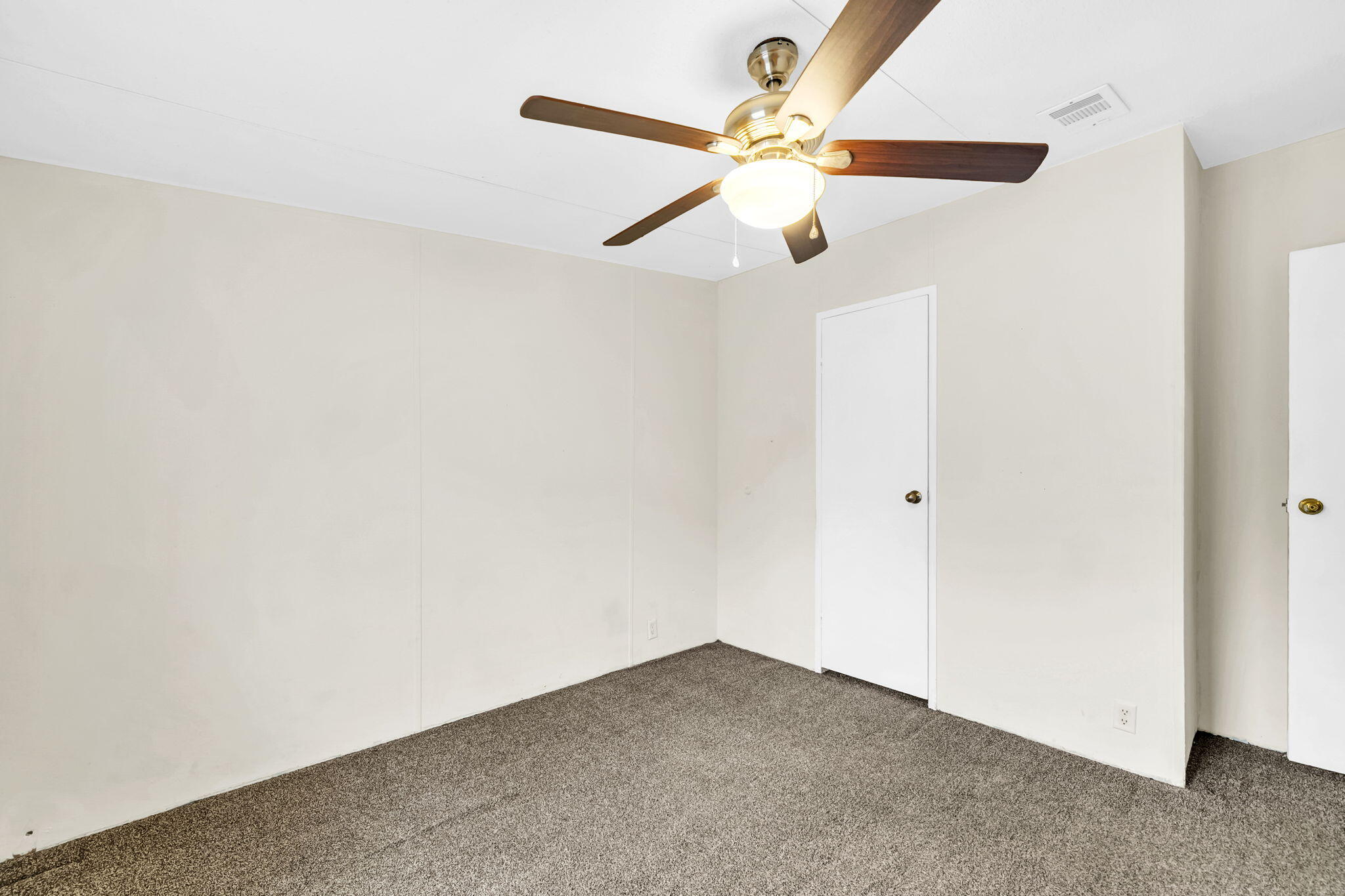 2236 Old Jolly Bay Road Freeport, FL 32439 - Photo 13 of 25 an empty room with a window and a fan