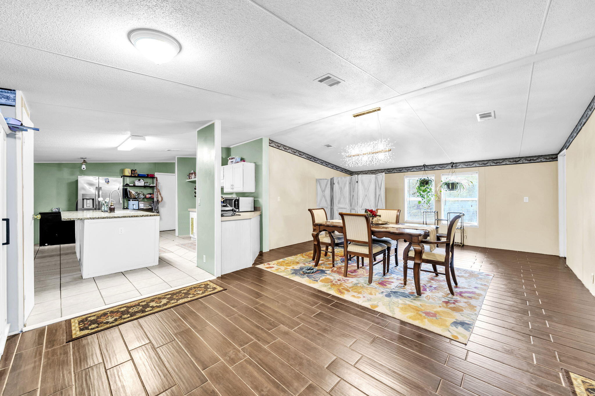 2236 Old Jolly Bay Road Freeport, FL 32439 - Photo 4 of 25 a view of a a dining room with furniture window and wooden floor