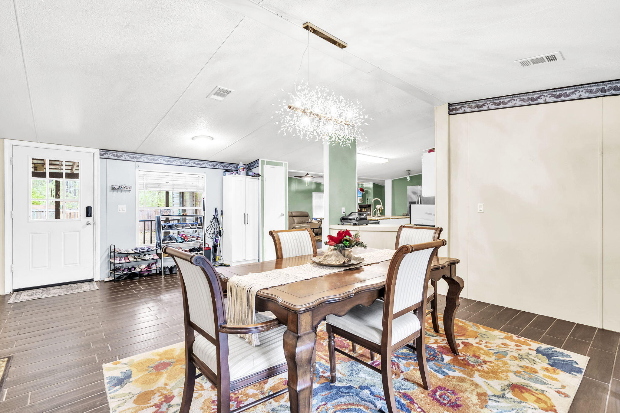 2236 Old Jolly Bay Road Freeport, FL 32439 - Photo 5 of 25 a dining room with furniture and wooden floor