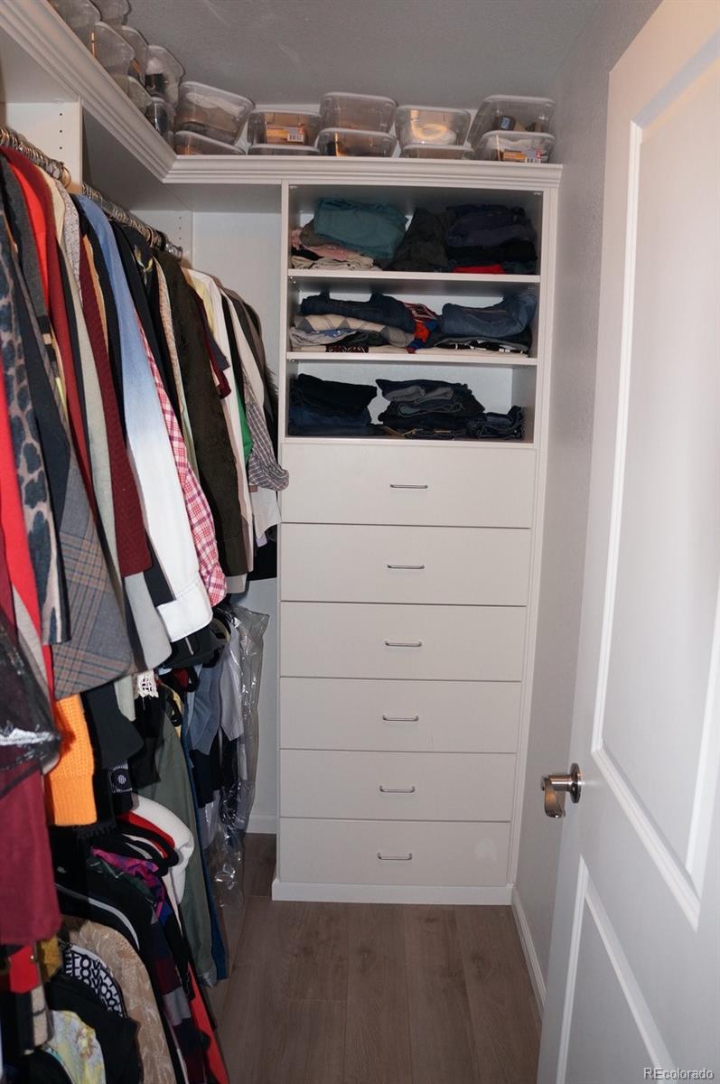 10269 Bellwether Lane Lone Tree, CO 80124 - Photo 15 of 17 a view of walk in closet with clothes and shoes