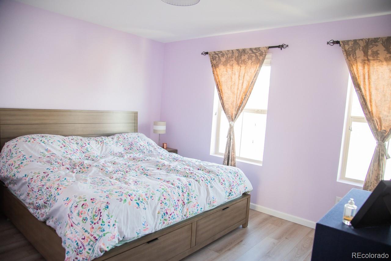 10269 Bellwether Lane Lone Tree, CO 80124 - Photo 8 of 17 a bedroom with a bed and a window