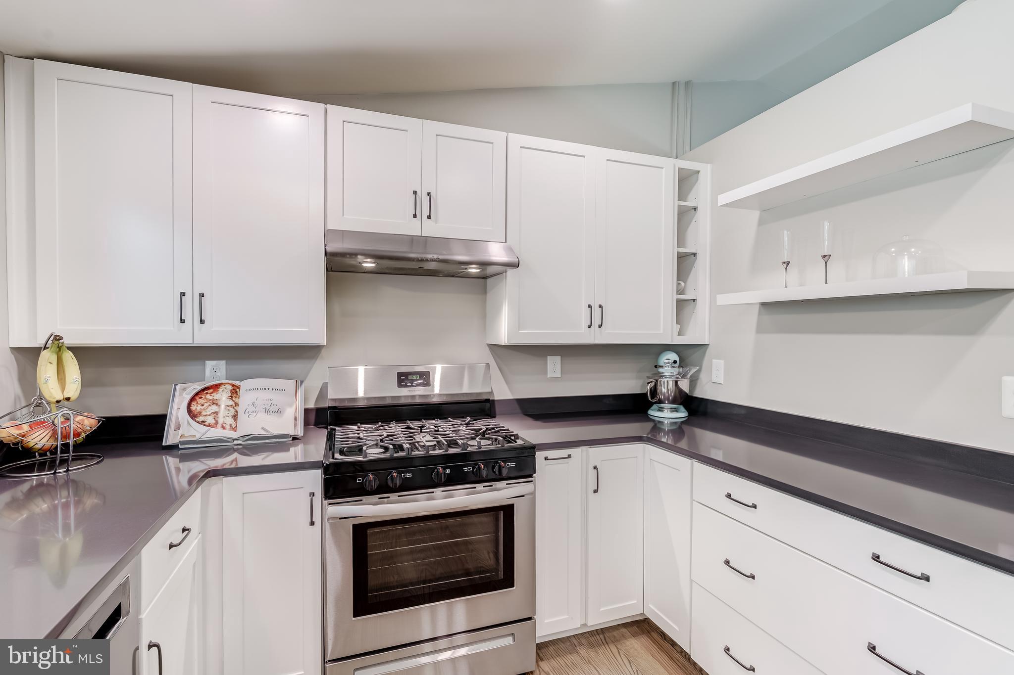 11926 Appling Valley Road Fairfax, VA 22030 - Photo 22 of 60 a kitchen with granite countertop white cabinets and white appliances