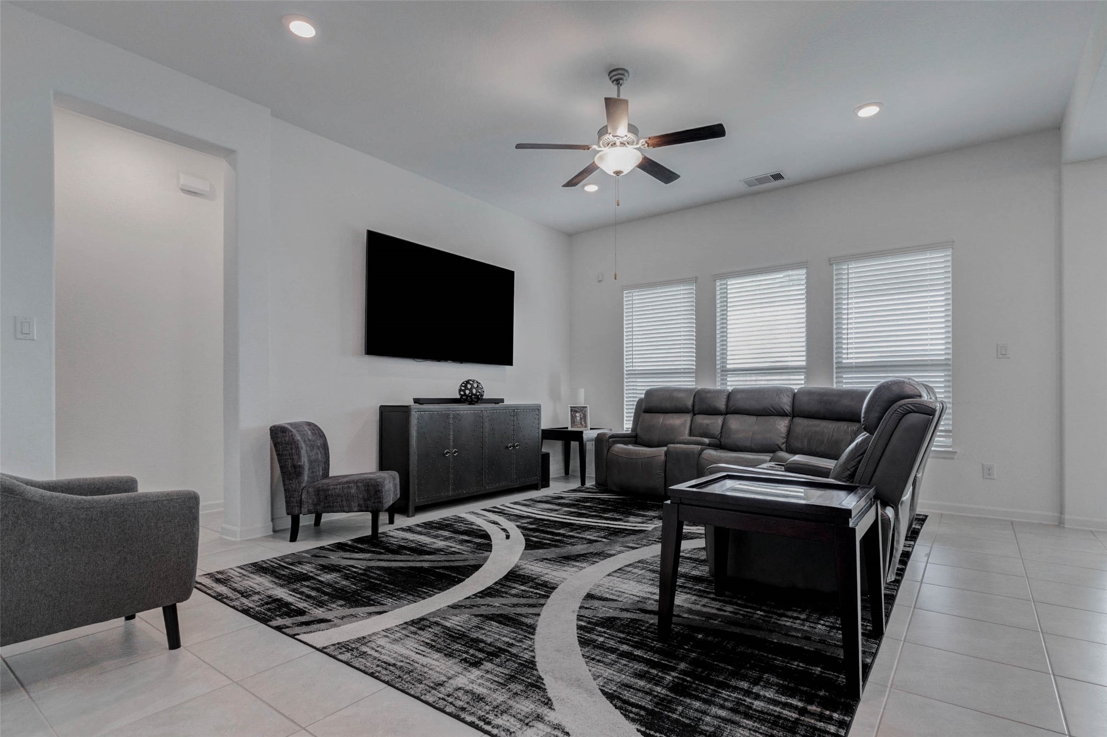 3711 Castle Rock Drive Rosenberg, TX 77469 - Photo 20 of 46 a living room with furniture and a flat screen tv