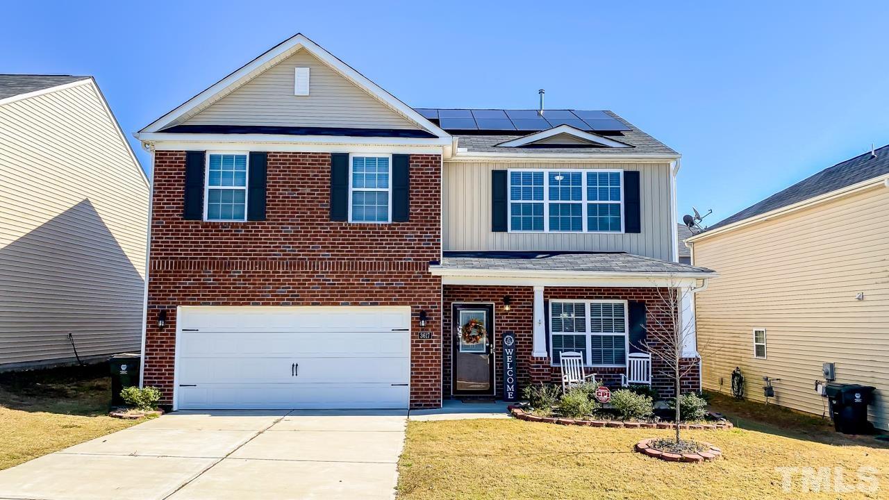 3617 Marble Ridge Lane Raleigh, NC 27610 - Photo 1 of 30 a front view of a house with yard