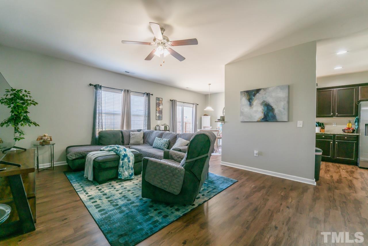 3617 Marble Ridge Lane Raleigh, NC 27610 - Photo 14 of 30 a living room with furniture and a flat screen tv