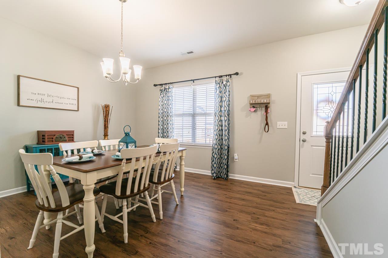 3617 Marble Ridge Lane Raleigh, NC 27610 - Photo 16 of 30 a view of a dining room with furniture window and wooden floor