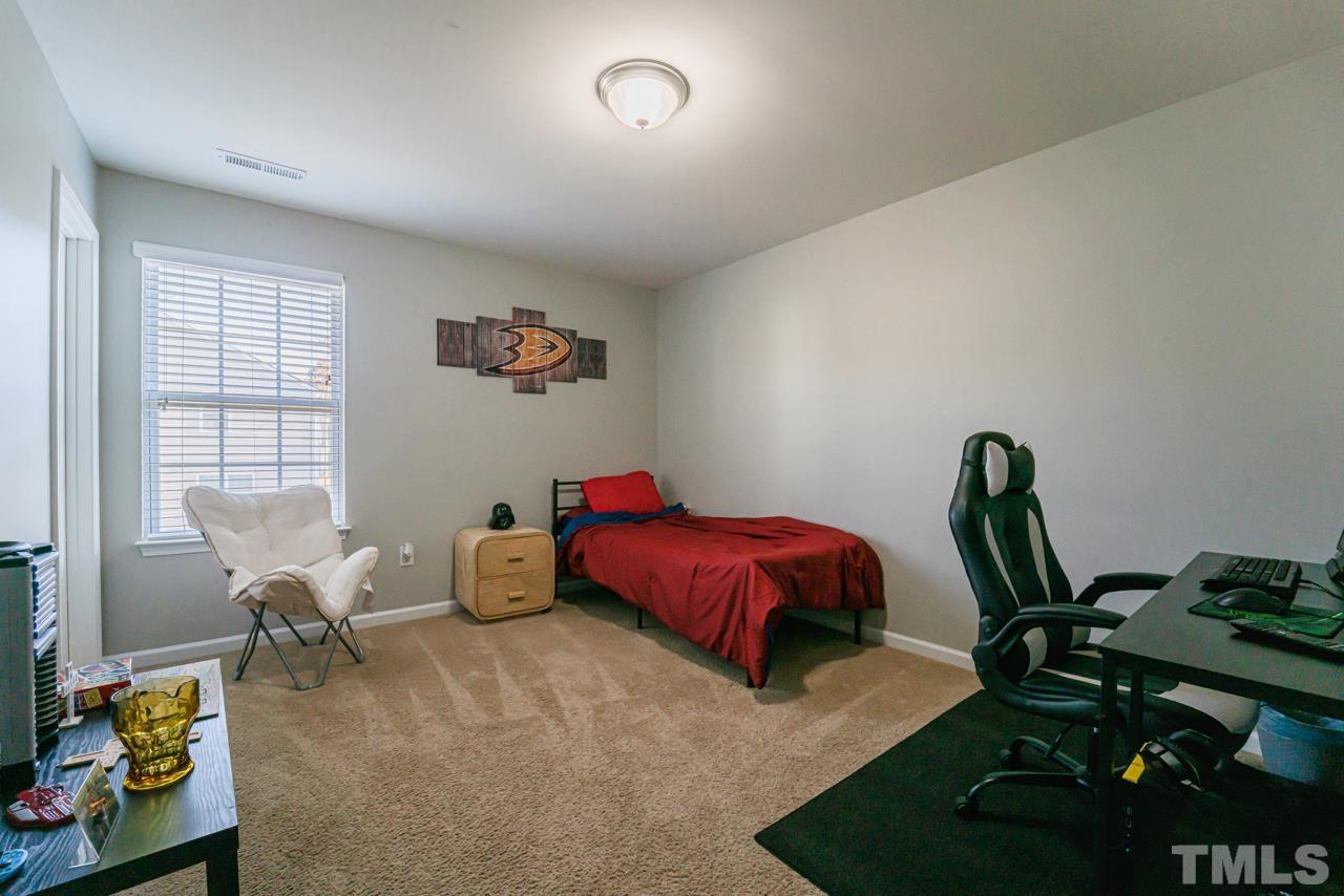 3617 Marble Ridge Lane Raleigh, NC 27610 - Photo 19 of 30 a bedroom with furniture and a window