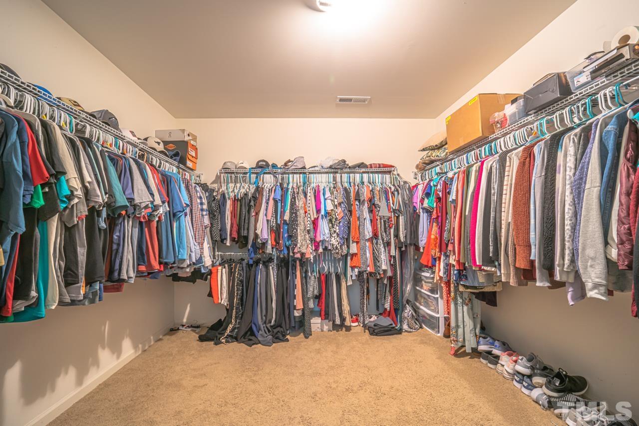 3617 Marble Ridge Lane Raleigh, NC 27610 - Photo 26 of 30 a view of walk in closet with clothes