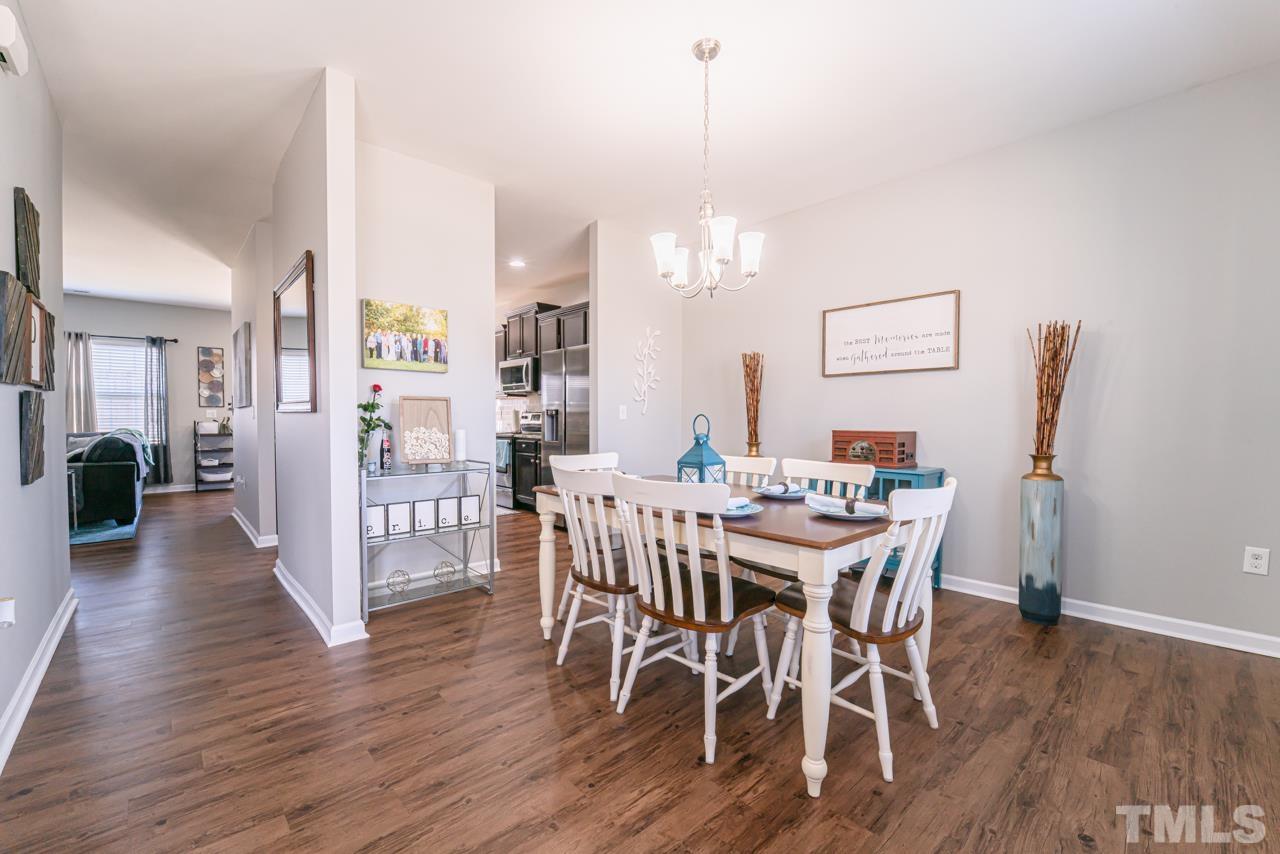 3617 Marble Ridge Lane Raleigh, NC 27610 - Photo 5 of 30 a view of a dining room with furniture and wooden floor