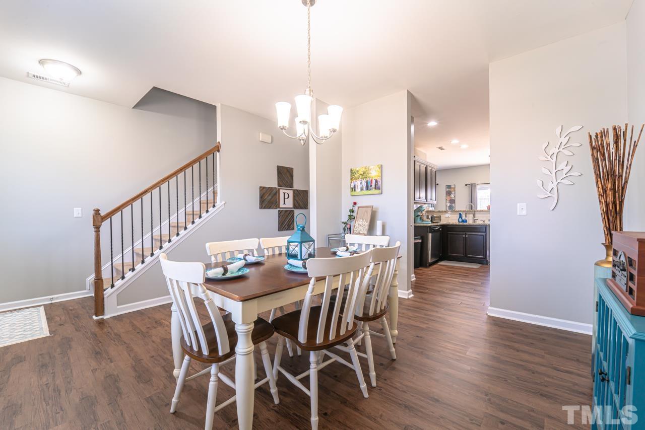 3617 Marble Ridge Lane Raleigh, NC 27610 - Photo 6 of 30 a view of a dining room with furniture and wooden floor