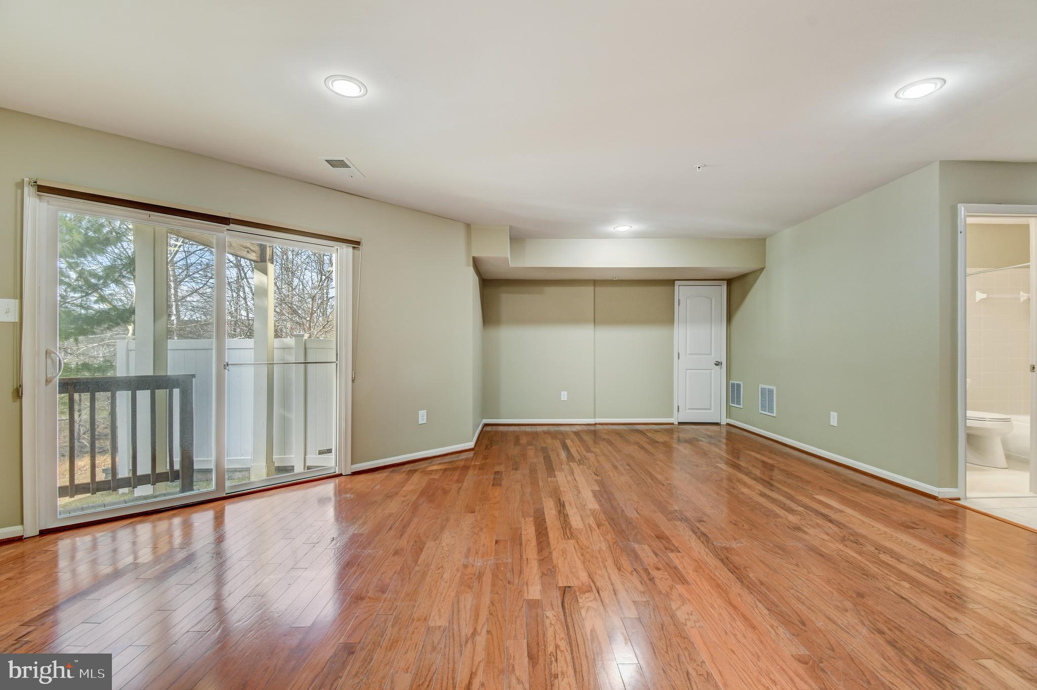 9851 Garden Ranges Laurel, MD 20723 - Photo 18 of 21 Lower Level Rec Room with outdoor access