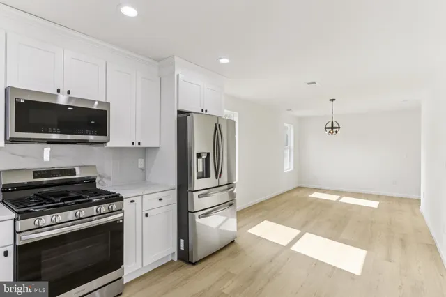a bathroom with a sink a toilet and a bathtub