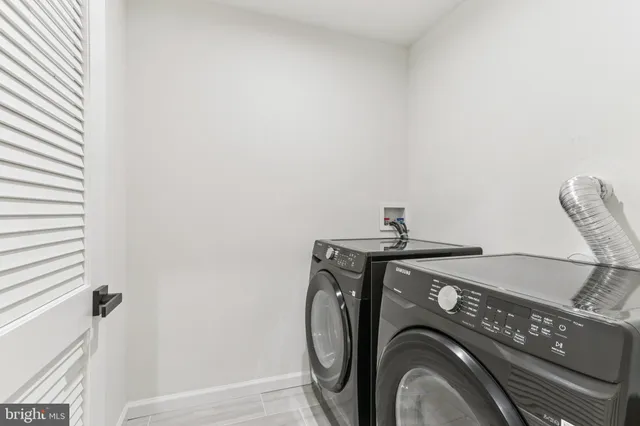 a bathroom with a shower sink and mirror
