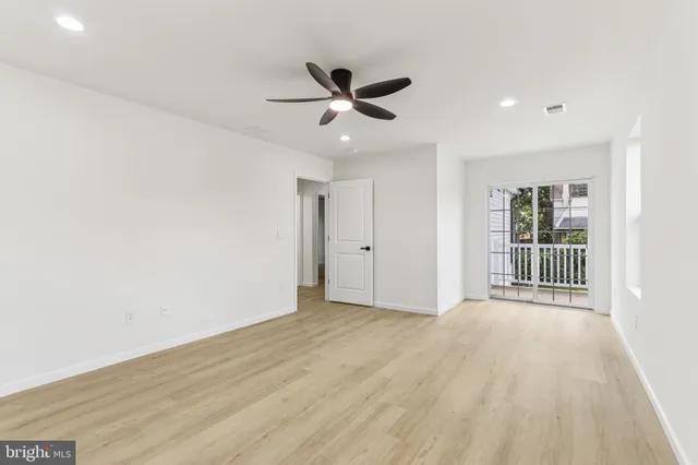 a bathroom with a double vanity sink mirror and toilet