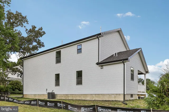 an aerial view of residential houses with city view