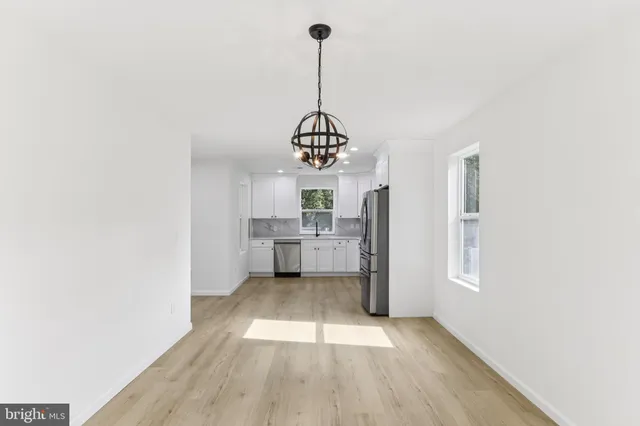 a kitchen with a sink cabinets and window