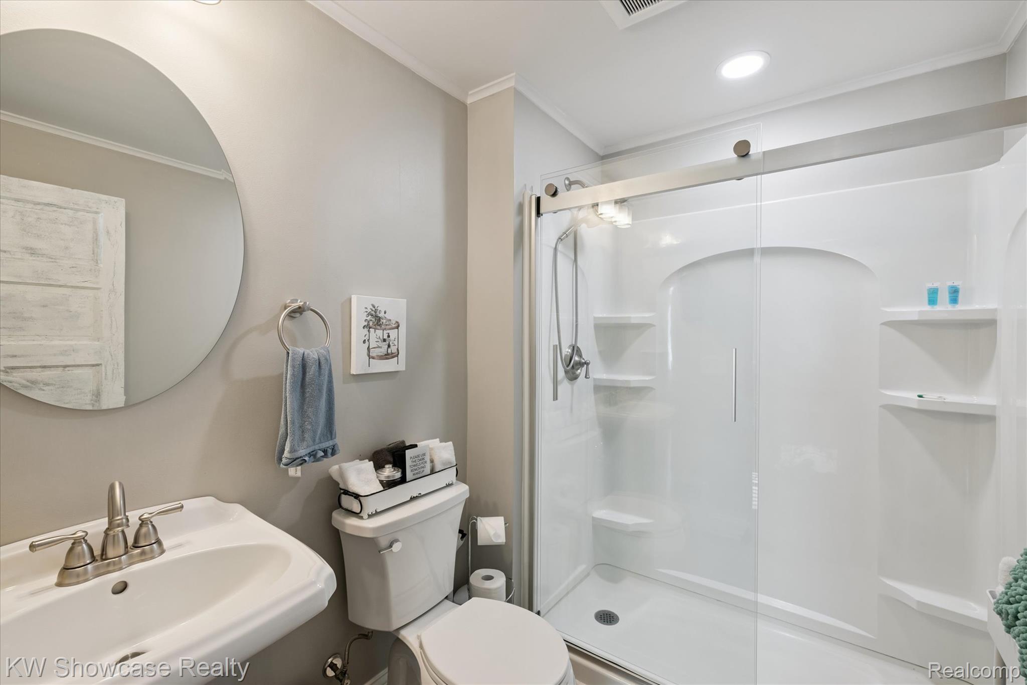 603 West Clinton Street Howell, MI 48843 - Photo 16 of 25 Bathroom with a shower stall, crown molding, and recessed lighting