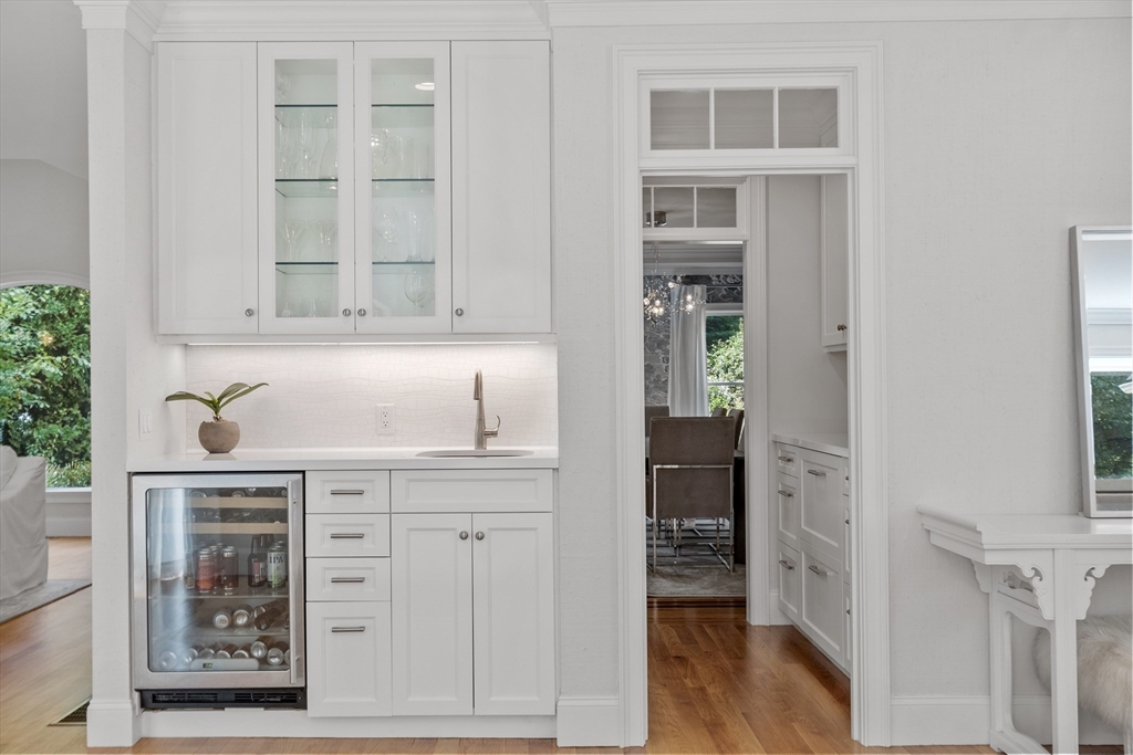 77 Revolutionary Road Concord, MA 01742 - Photo 12 of 42 a kitchen with cabinets and wooden floor