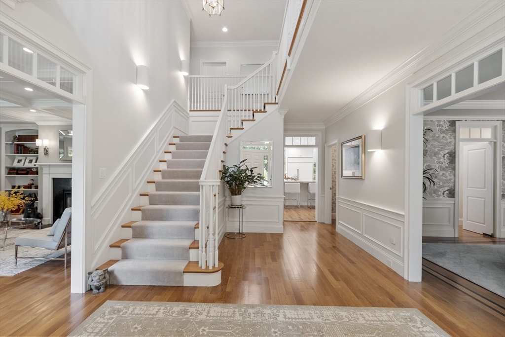 77 Revolutionary Road Concord, MA 01742 - Photo 16 of 42 a view of entryway and hall with wooden floor