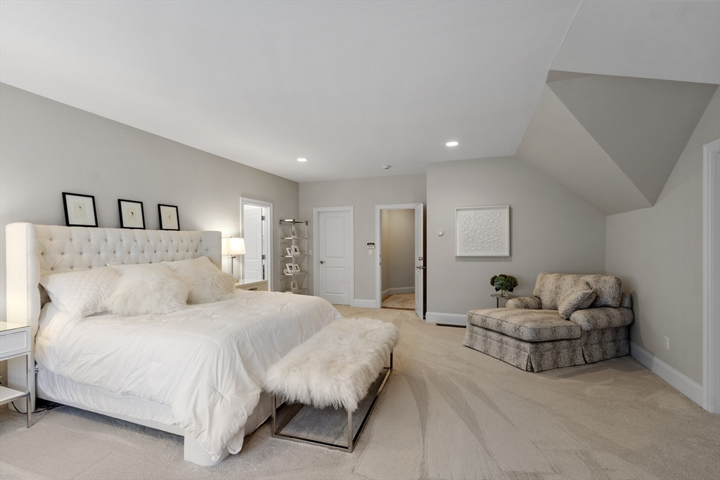 77 Revolutionary Road Concord, MA 01742 - Photo 18 of 42 a bedroom with a bed and a couch