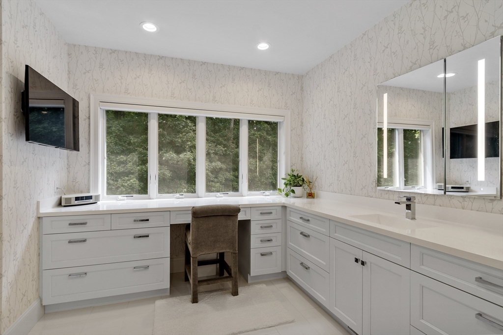 77 Revolutionary Road Concord, MA 01742 - Photo 19 of 42 a kitchen with a sink stove and microwave