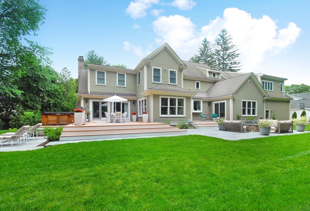 77 Revolutionary Road Concord, MA 01742 - Photo 2 of 42 a front view of a house with a yard