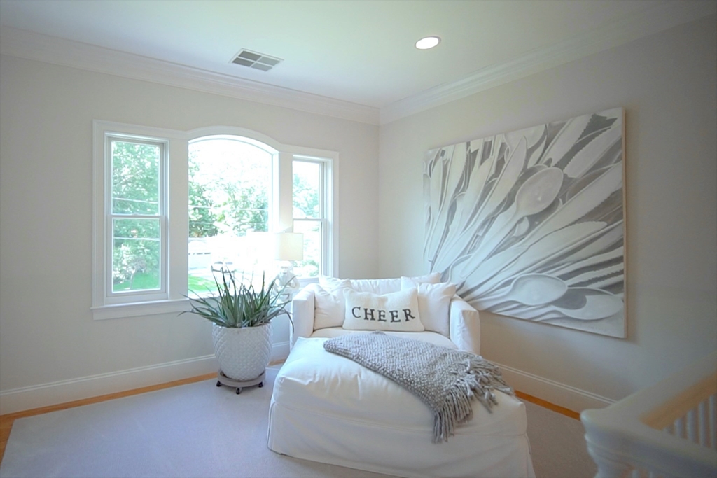 77 Revolutionary Road Concord, MA 01742 - Photo 22 of 42 a spacious bedroom with a bed and a window
