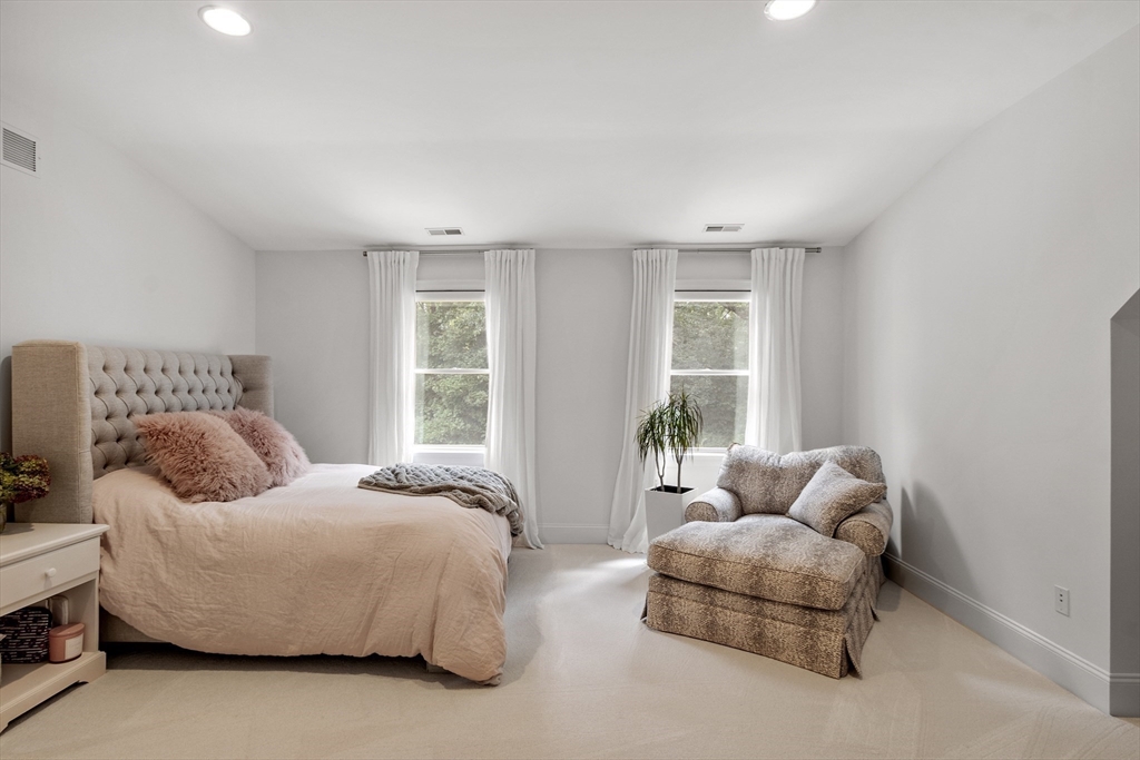77 Revolutionary Road Concord, MA 01742 - Photo 26 of 42 a bedroom with bed couch and window
