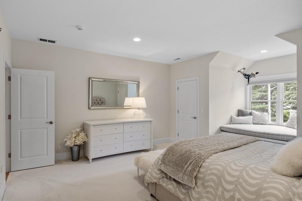 77 Revolutionary Road Concord, MA 01742 - Photo 29 of 42 a bedroom with a bed and a dresser