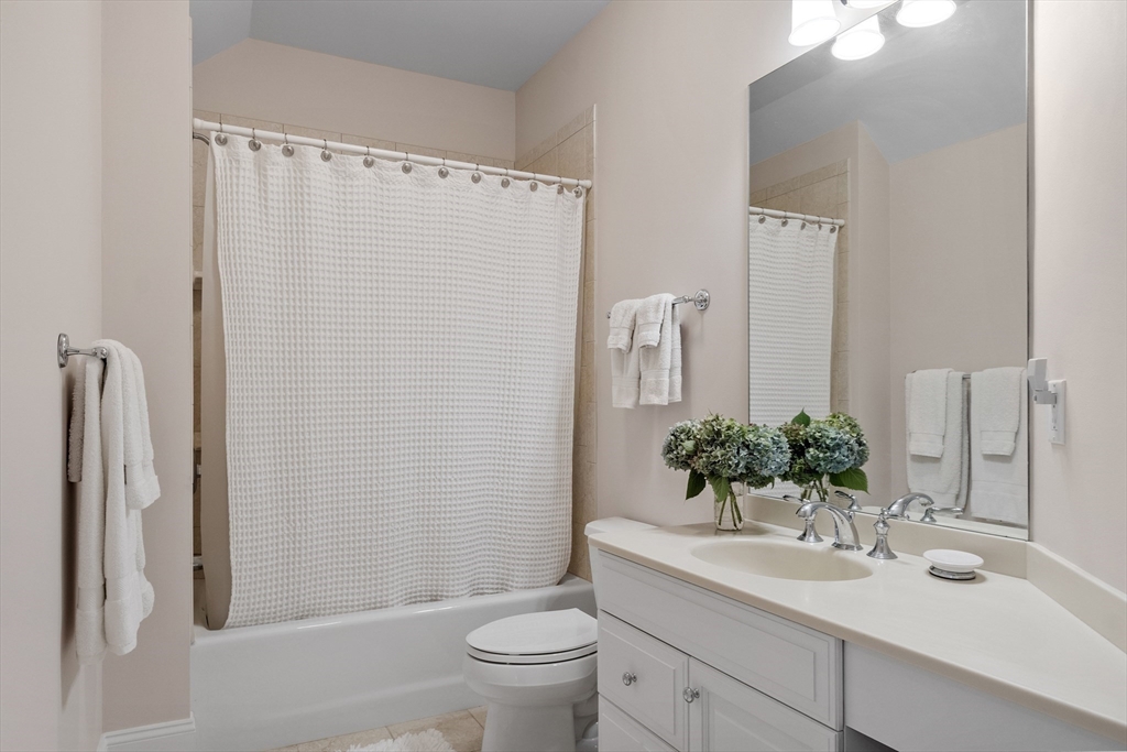 77 Revolutionary Road Concord, MA 01742 - Photo 30 of 42 a bathroom with a sink toilet and shower