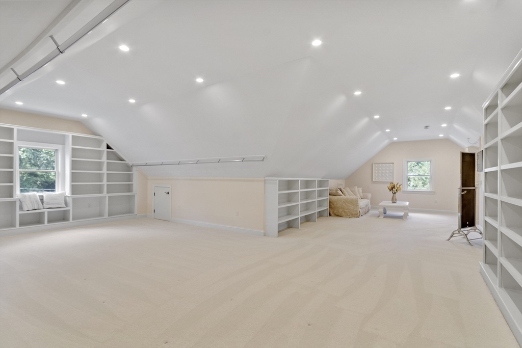 77 Revolutionary Road Concord, MA 01742 - Photo 32 of 42 a view of a room with gym equipment and a large window