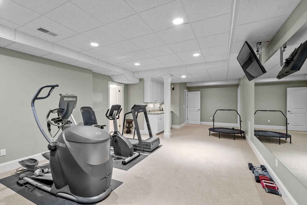 77 Revolutionary Road Concord, MA 01742 - Photo 35 of 42 a view of a room with gym equipment