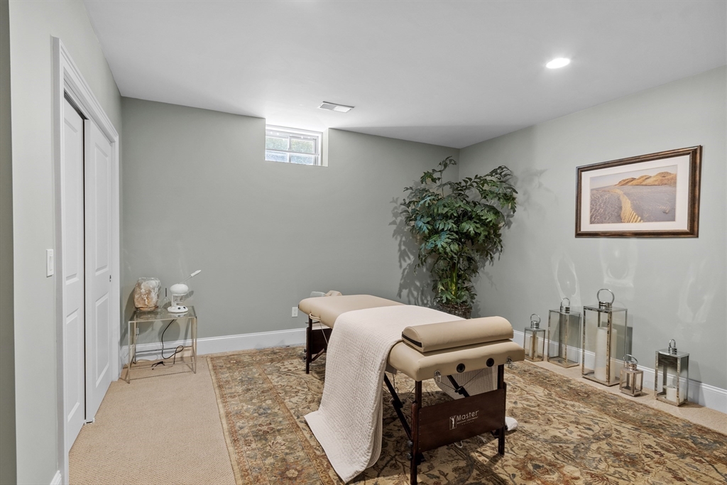 77 Revolutionary Road Concord, MA 01742 - Photo 36 of 42 a living room with furniture flowerpot and wooden floor