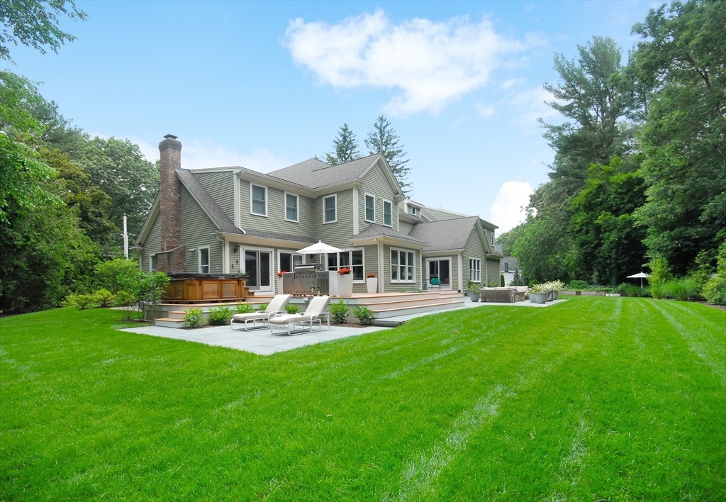 77 Revolutionary Road Concord, MA 01742 - Photo 37 of 42 a front view of a house with swimming pool having outdoor seating