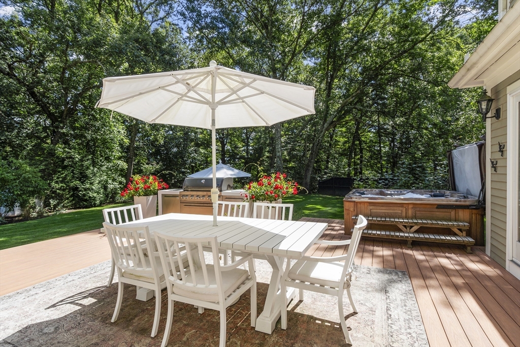 77 Revolutionary Road Concord, MA 01742 - Photo 40 of 42 a patio with a patio table and chairs