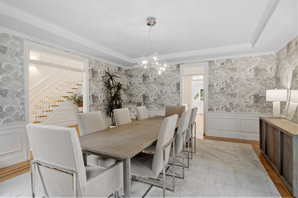 77 Revolutionary Road Concord, MA 01742 - Photo 6 of 42 a view of a dining room with furniture and chandelier