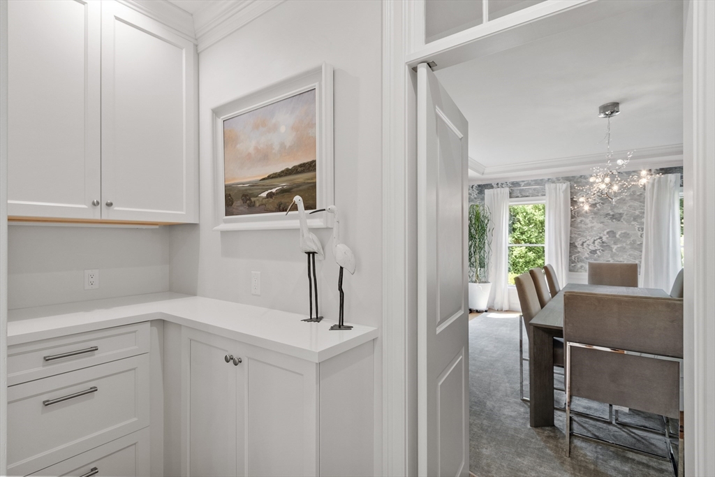 77 Revolutionary Road Concord, MA 01742 - Photo 8 of 42 a kitchen with a table and chairs