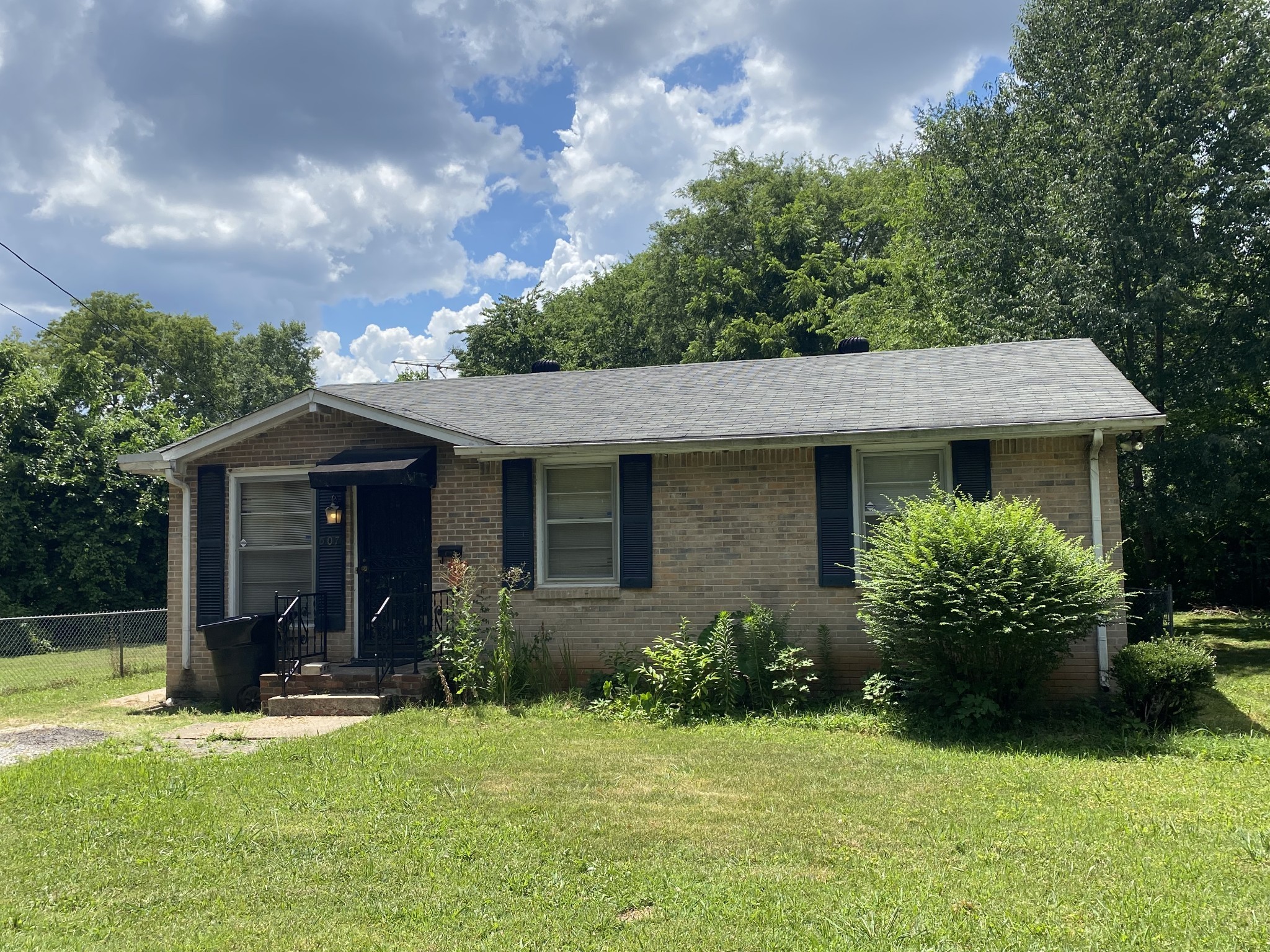 507 Courtland Street Murfreesboro, TN 37130 - Photo 1 of 25 a view of a house with backyard and garden
